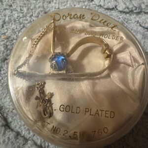 Vintage glove holder …gold tone with blue stones. 1940’s 1950’s